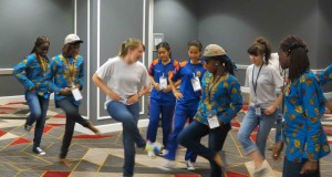 After making the video, the girls from the United States teach the others some new country line dancing moves