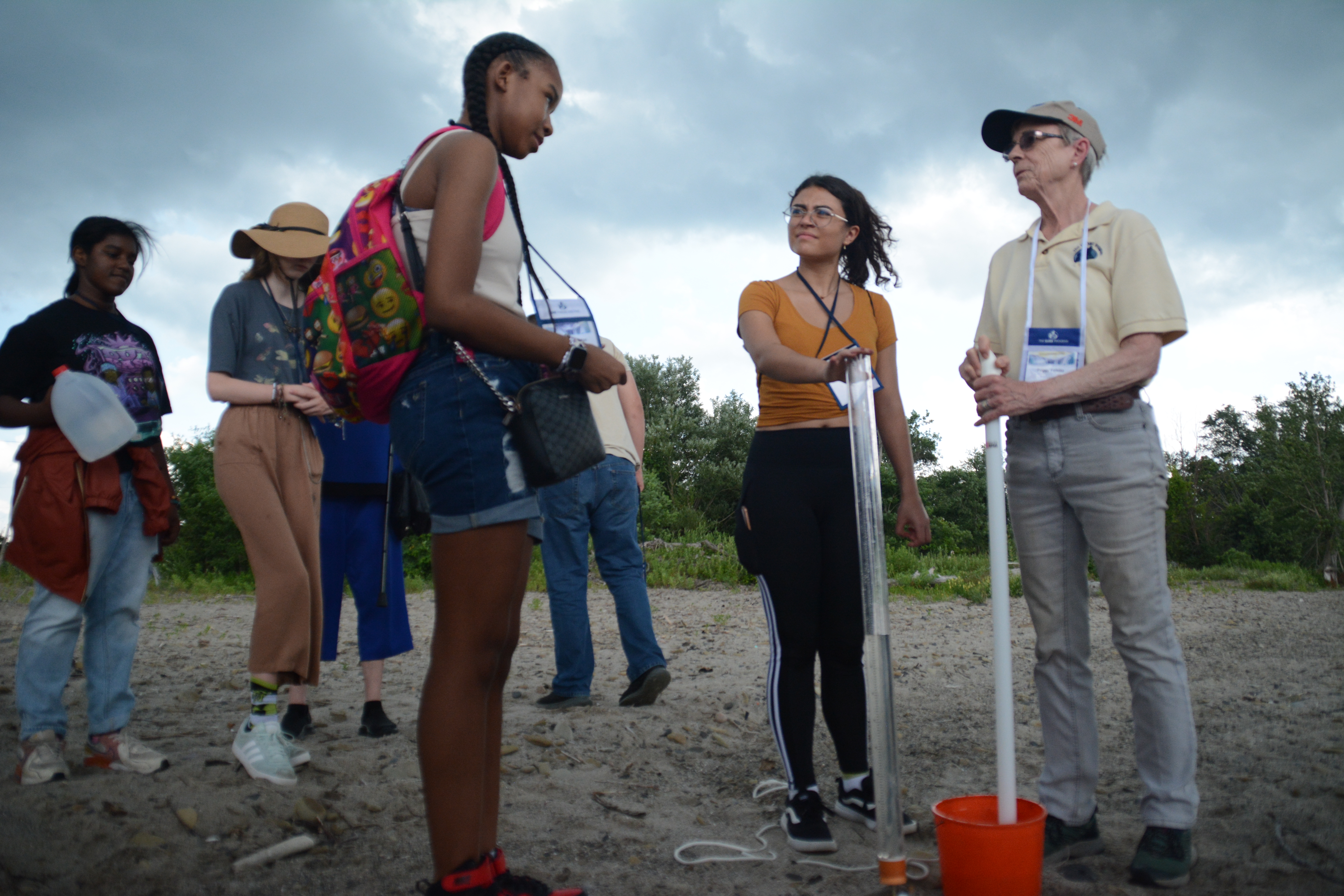 Students at Lake Erie with an instructor taking measurements at the 2024 GLOBE Annual Meeting