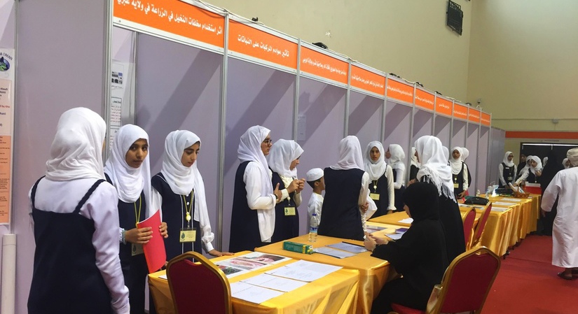 Oman female students getting ready for the GLOBE Environmental Research Fair