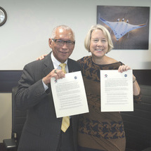 Photo of NASA Administrator Charles Bolden and Peace Corps Director Carrie Hessler-Radelet at signing of the Letter of Intent