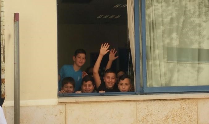 Young children in Israel -- waving