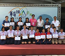 A large group of students and teachers stand together for a picture.