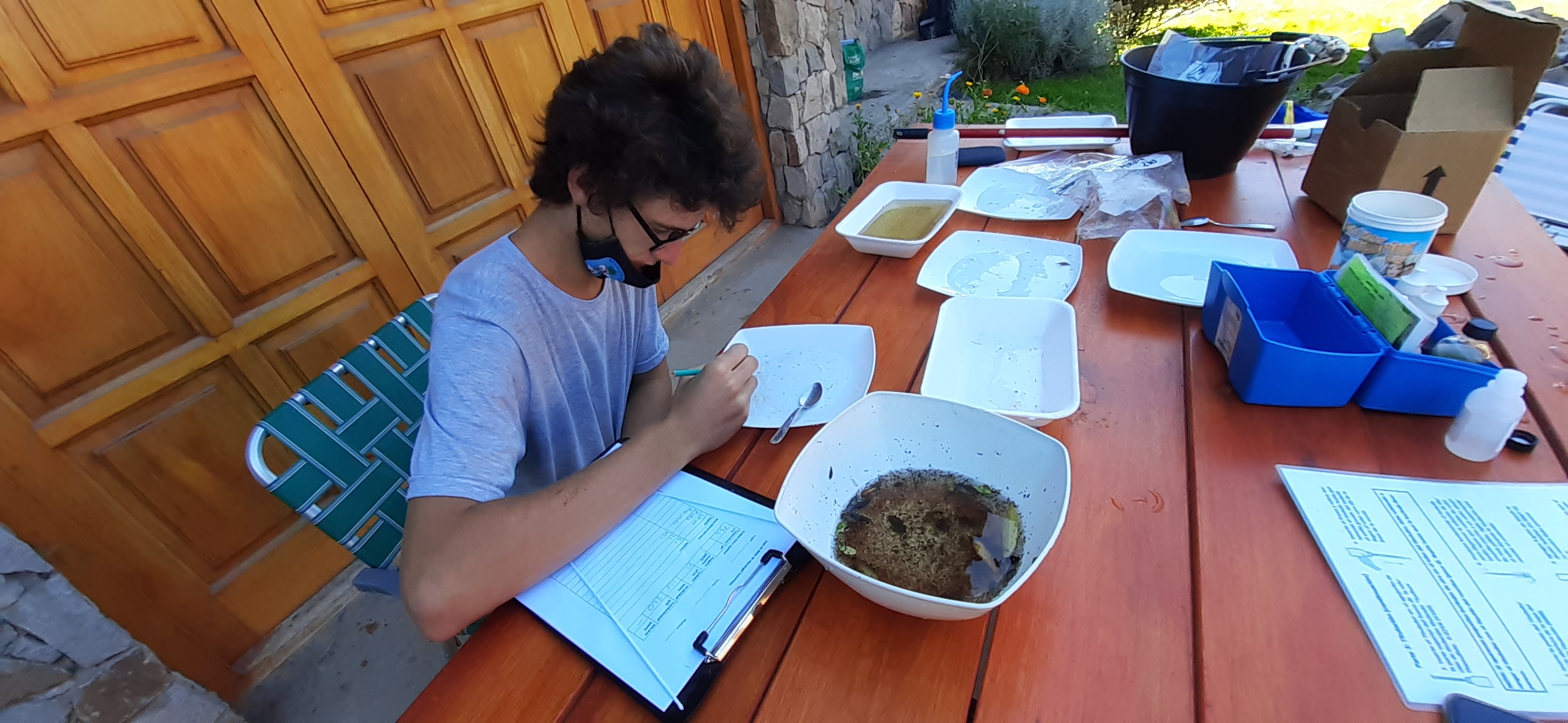 Photo of Juan working at an outdoor table