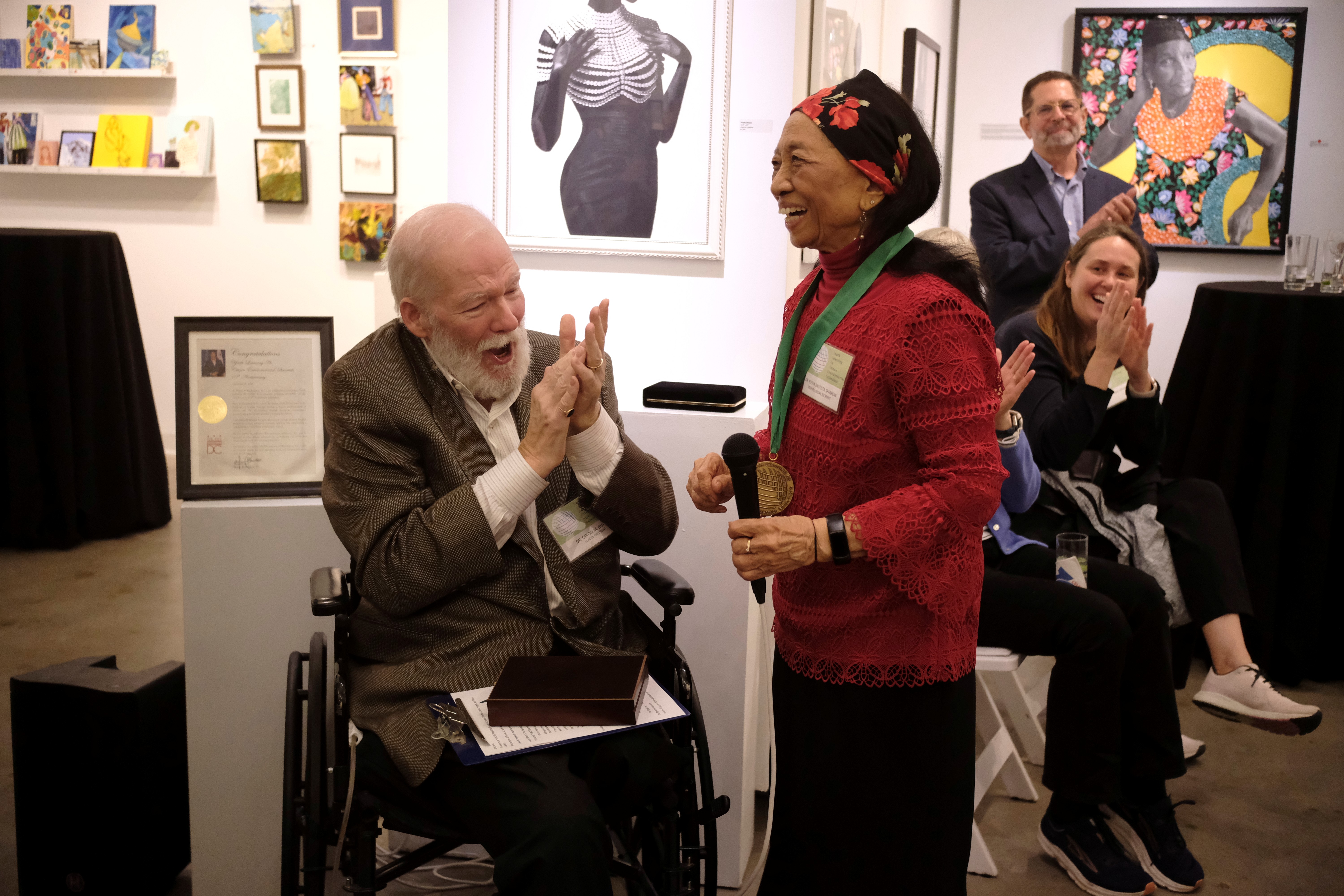 Dr. Dixon M. Butler presents Dr. Elena Bautista Sparrow with the Youth Environmental Science (YES) Medal