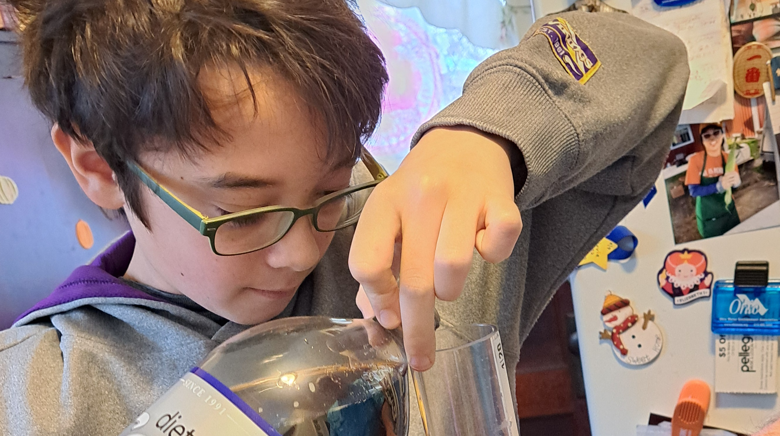 Stevie is pouring cola into the turbidity tube.