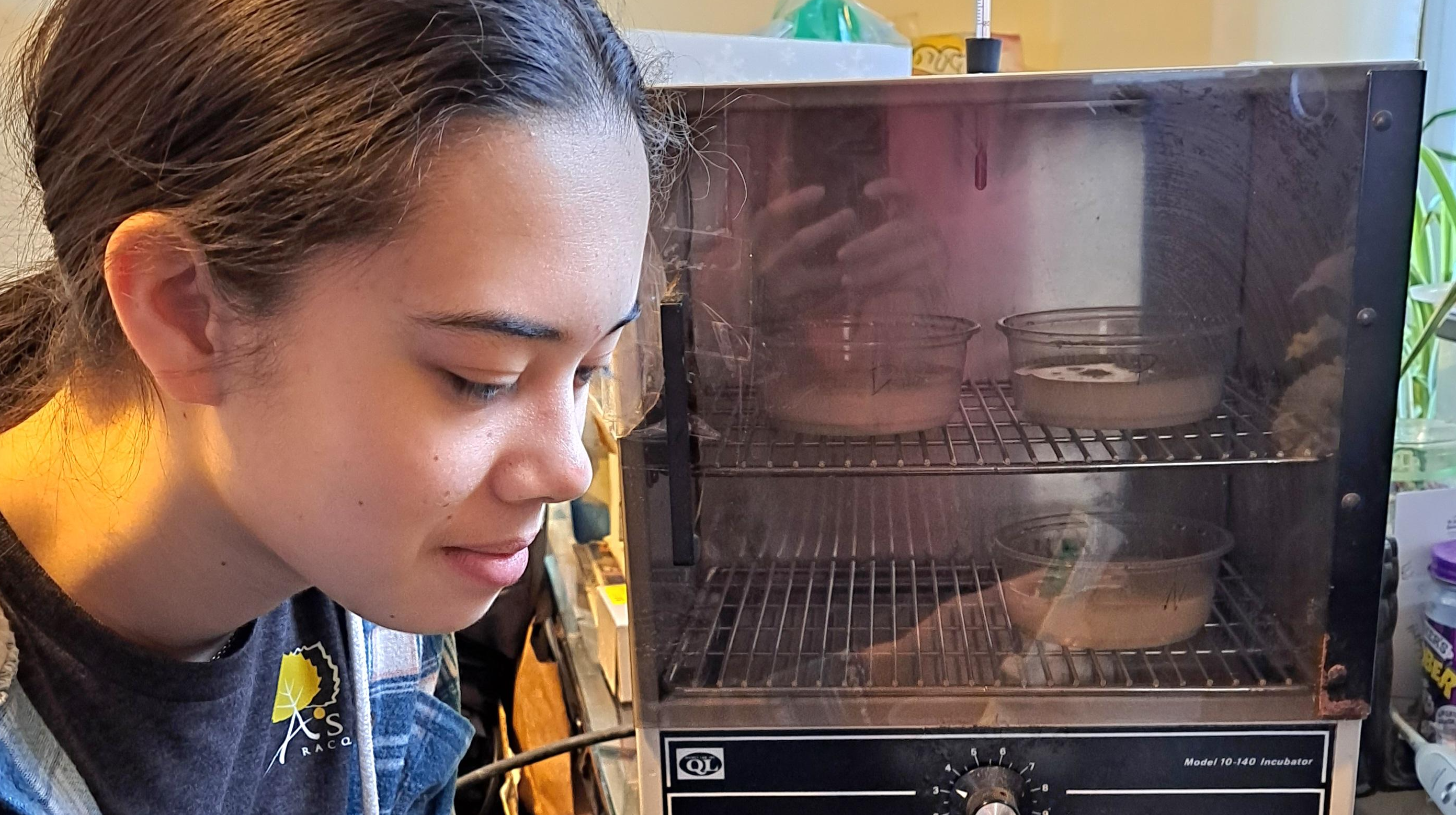 Elizabeth is taking the pH and temperature of the milk.