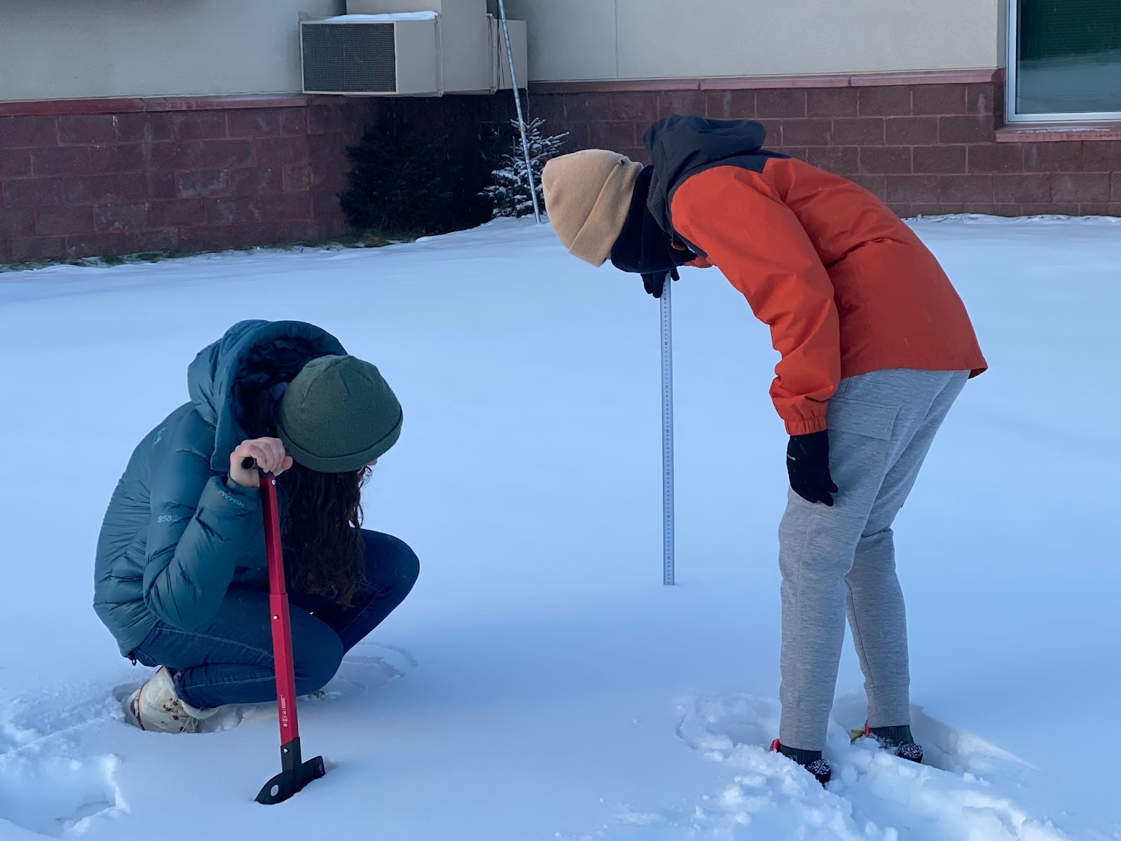 GLOBE students collecting snow depth measurements.