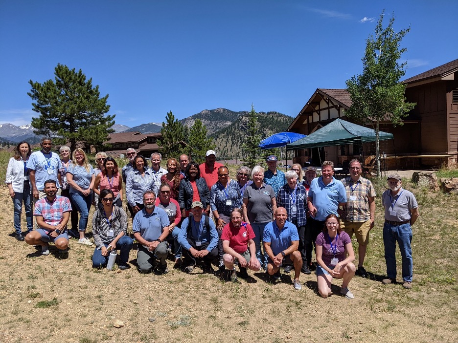 nearly 40 Earth System Science Collaborative conference attendees are lined up in two rows