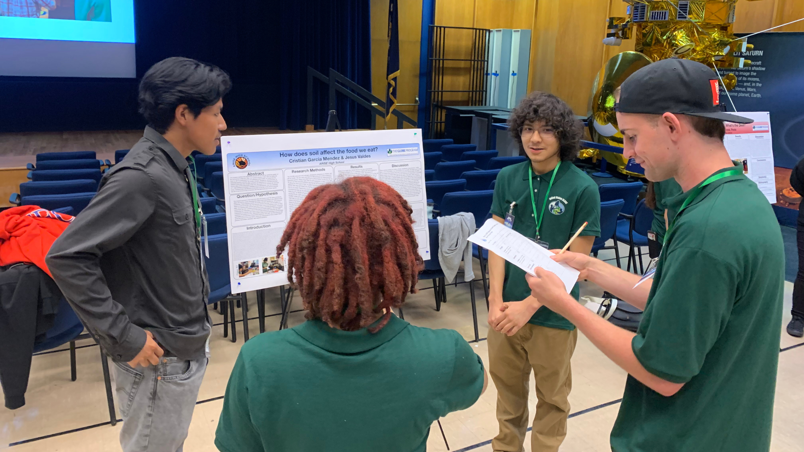 Students present their research to other students during the peer review session