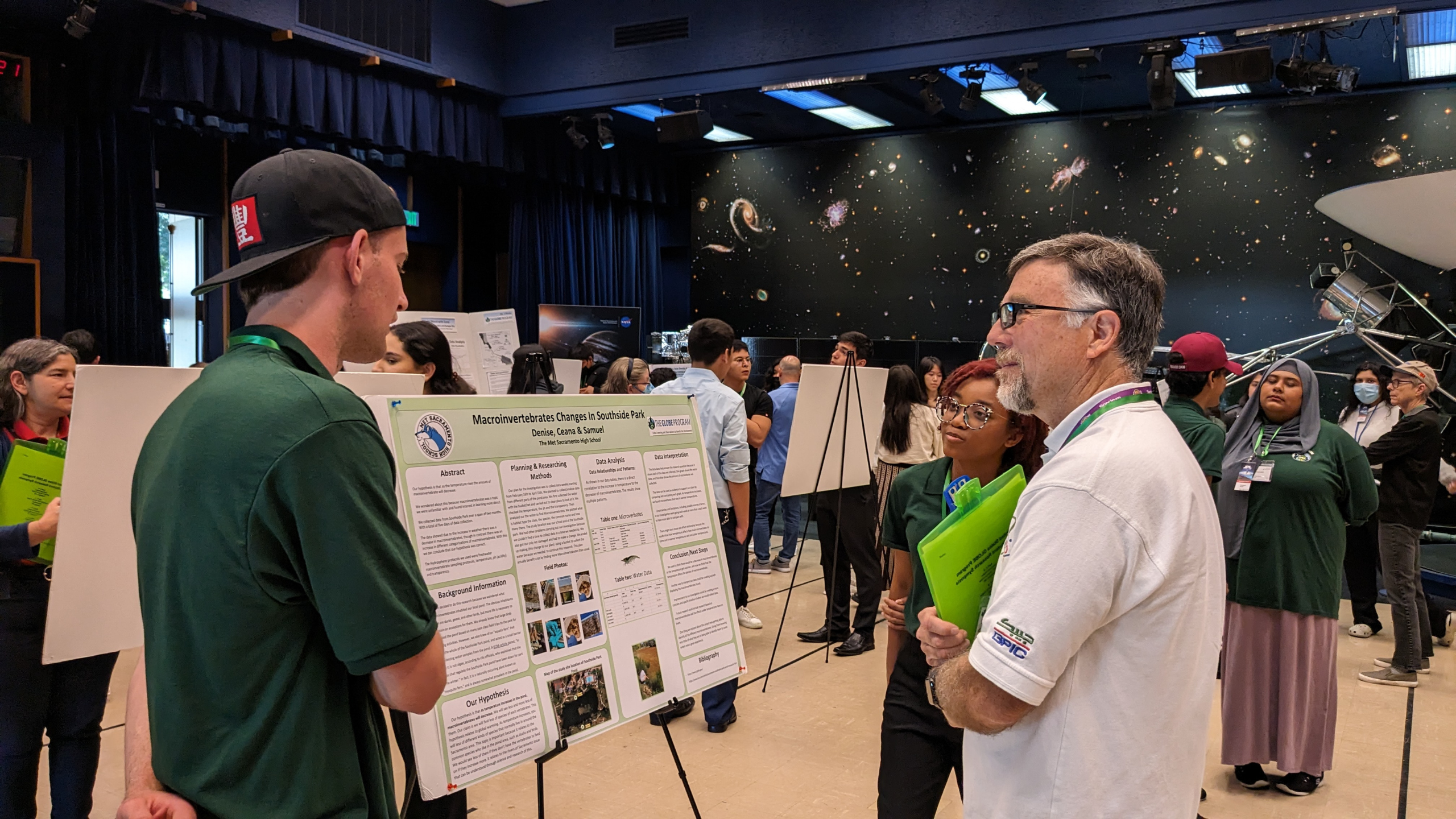 students present their research to a STEM professional at a GLOBE U.S. Regional Student Research Symposium