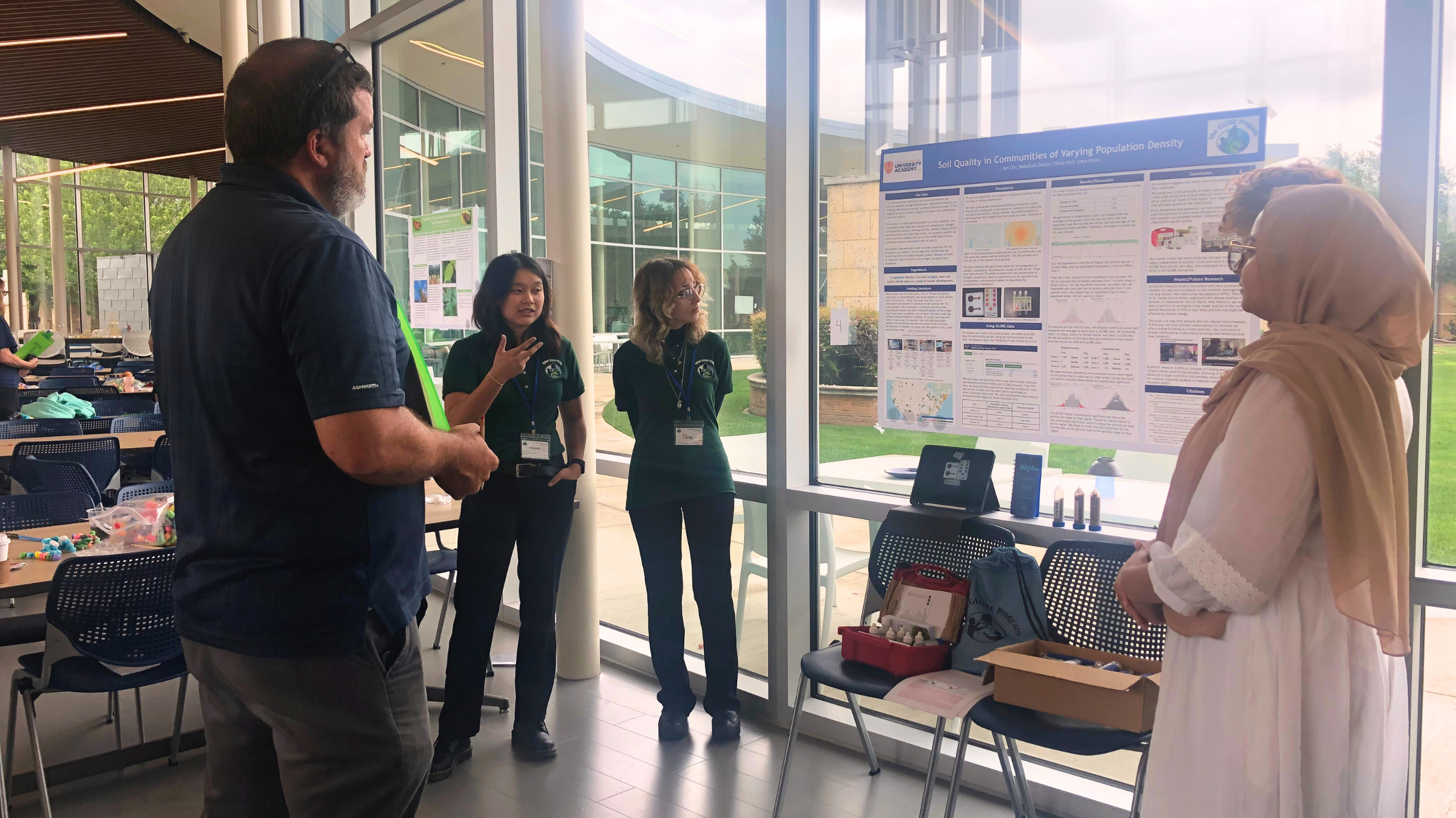 students present their research to a STEM professional at the Southwest Student Research Symposium  