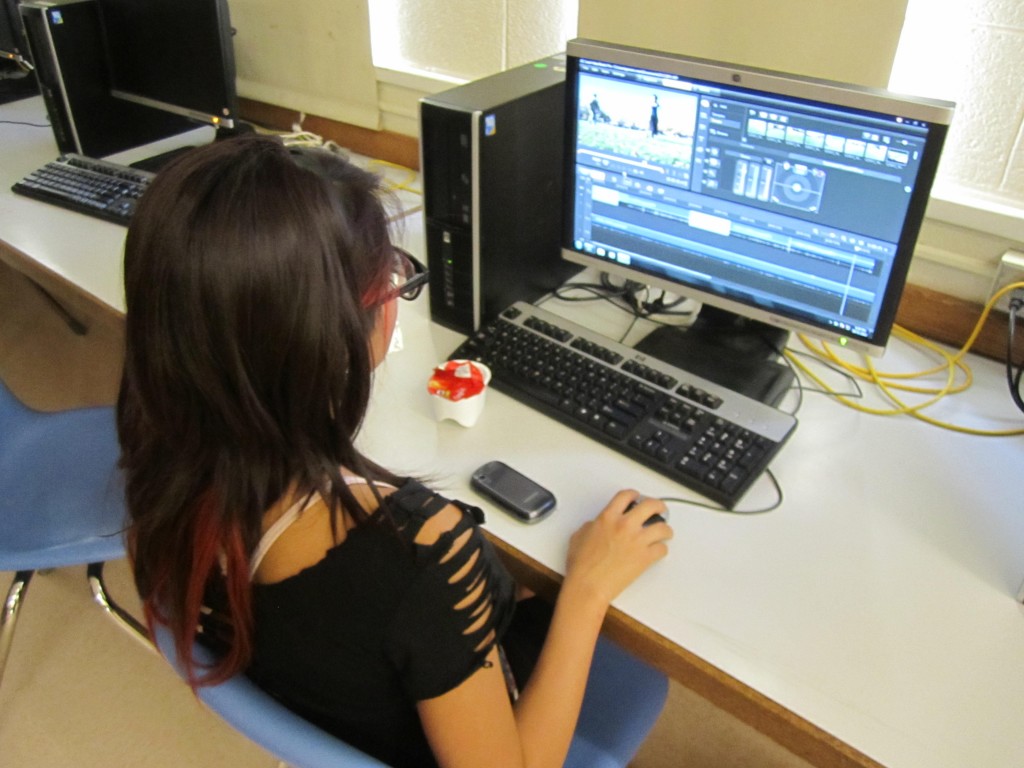 A CLACE student edits her climate video.