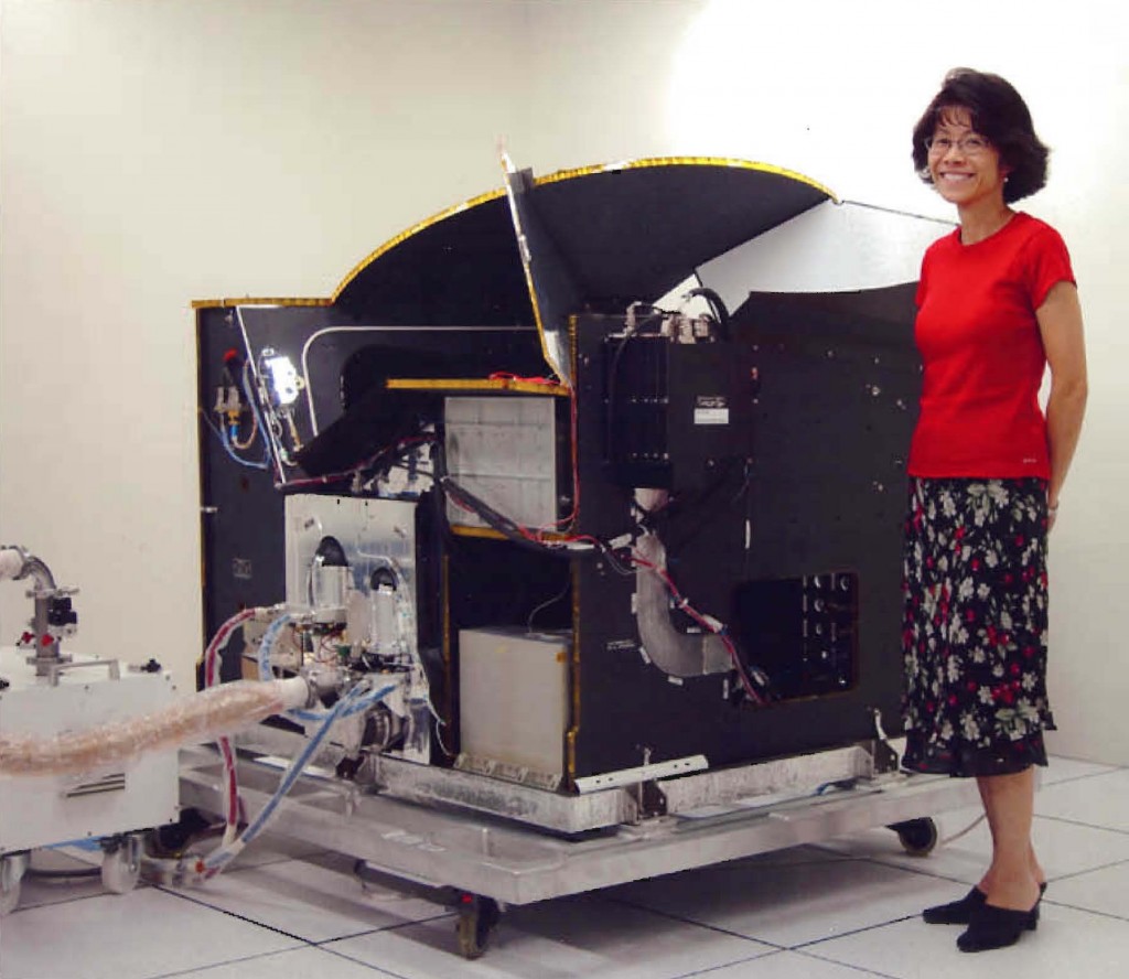 HIRDLS Project Manager, Joann Loh, stands beside the HIRDLS Engineering Module.