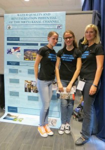 Students from Medicinska skola u Rijeci stand with their teacher in front of their poster